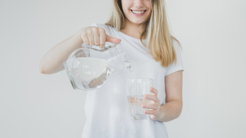 blonde-girl-filling-glass-water.jpg